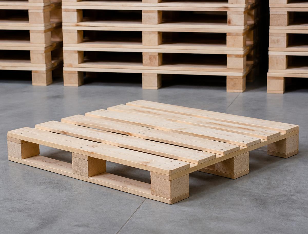 A plain UK standard 1200 by 1000 mm wooden pallet on a warehouse floor